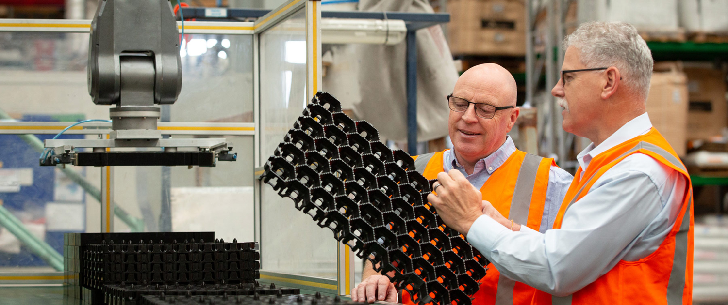 Bruce and Alan examining JakMat product